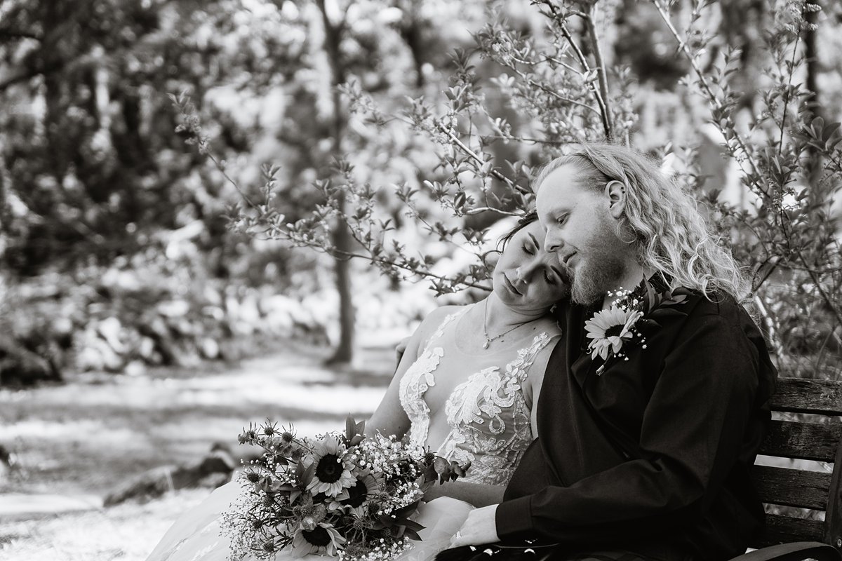 Bride and groom share an intimate moment at the Riordan Mansion by Flagstaff wedding photographers PMA Photography.