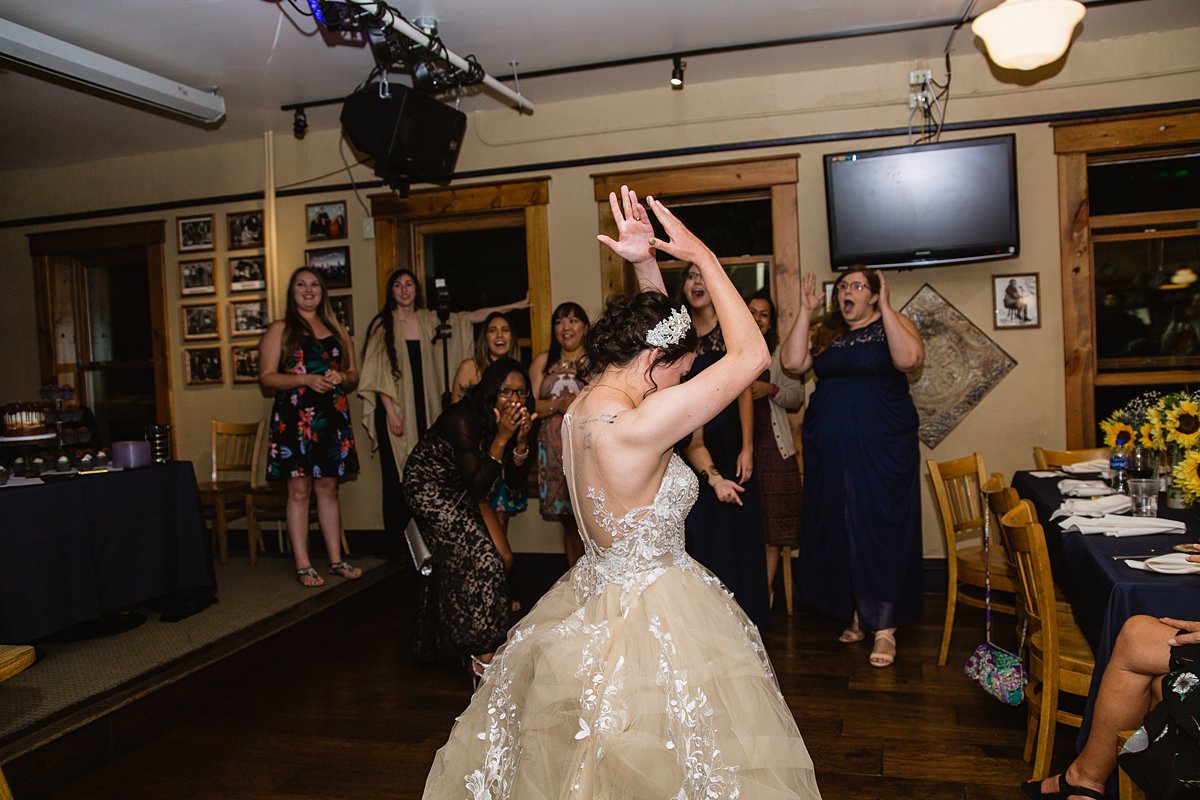 The bride tossed the bouquet away from the single ladies in this funny wedding dy blooper by PMA PHotography.