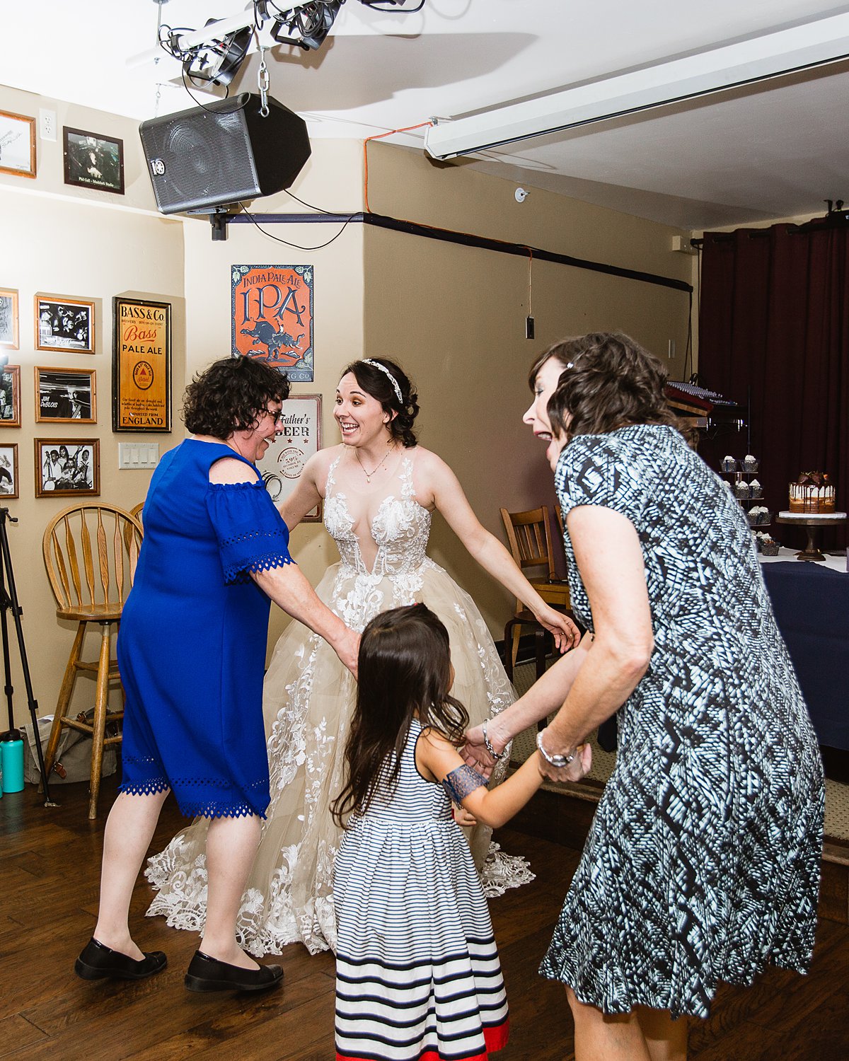 Bride dancing with her mother and guests at her wedding reception at the Weatherford Hotel in Flagstaff Arizona by wedding photographers PMA Photography.