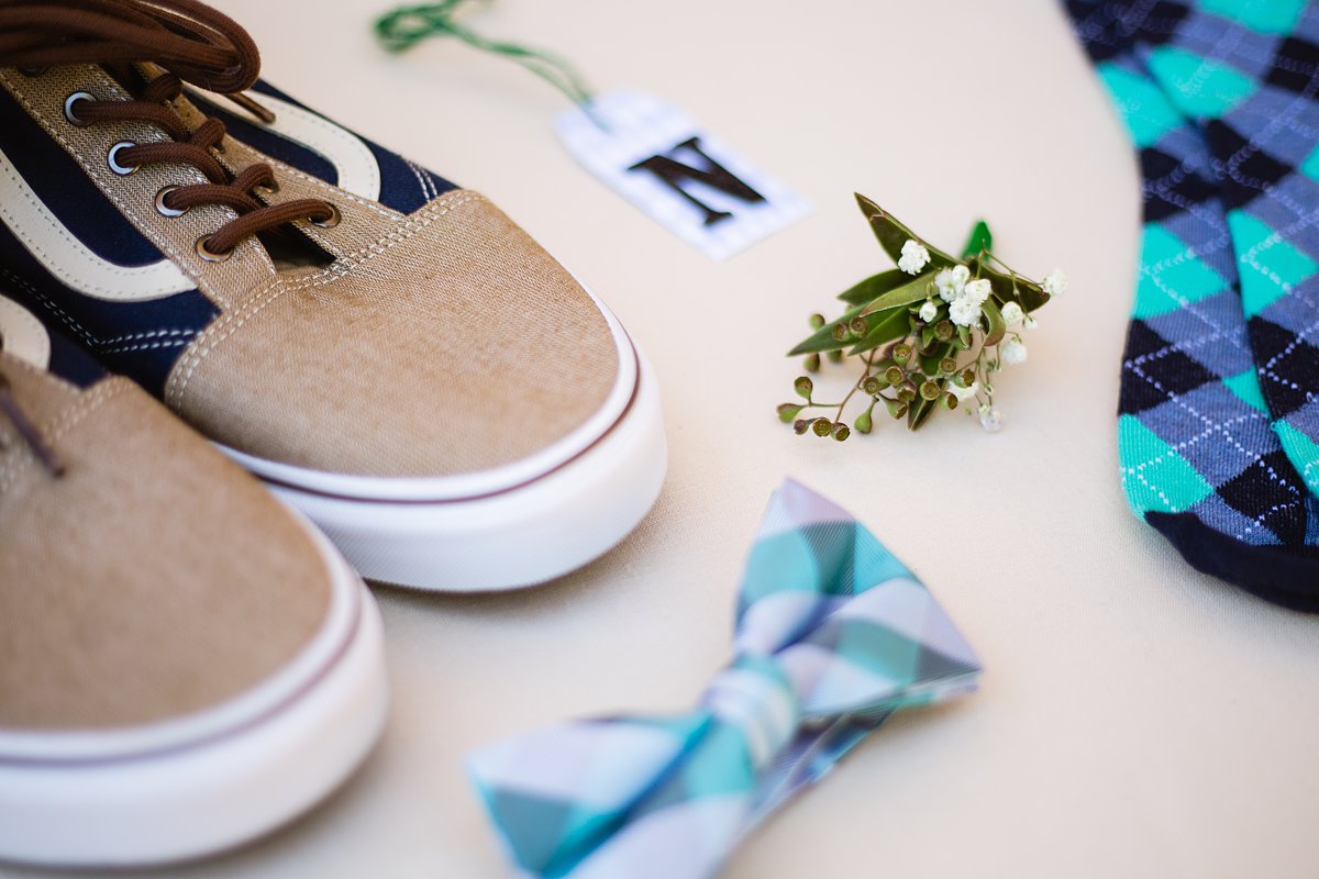 Teal and grey groom wedding details of a bow tie, succulent boutonniere, and vans by PMA Photography.