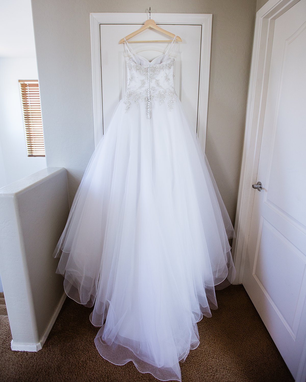 Back of the bride's wedding dress by PMA Photography.