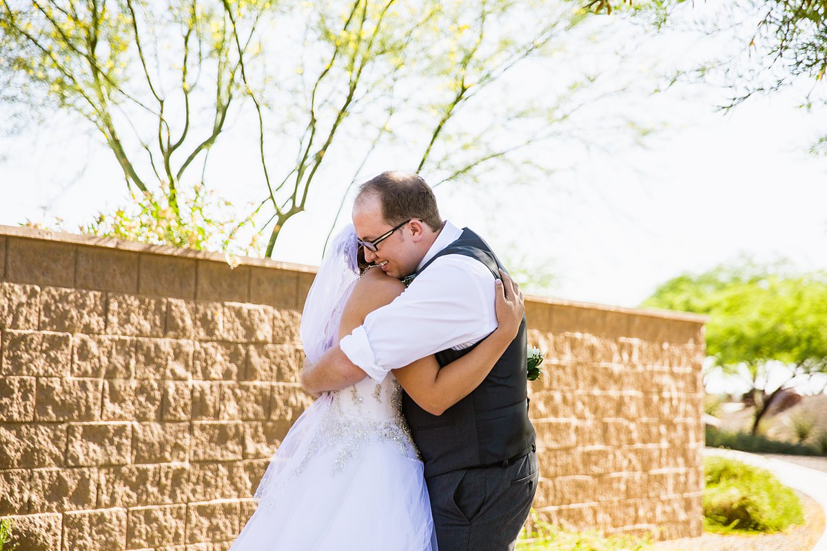 Bride and grooms reactions during their first look by Arizona wedding photographer PMA Photography.