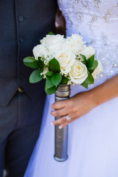 Simple rose and wax flower wedding bouquet in a Star Wars hilt by PMA Photography.