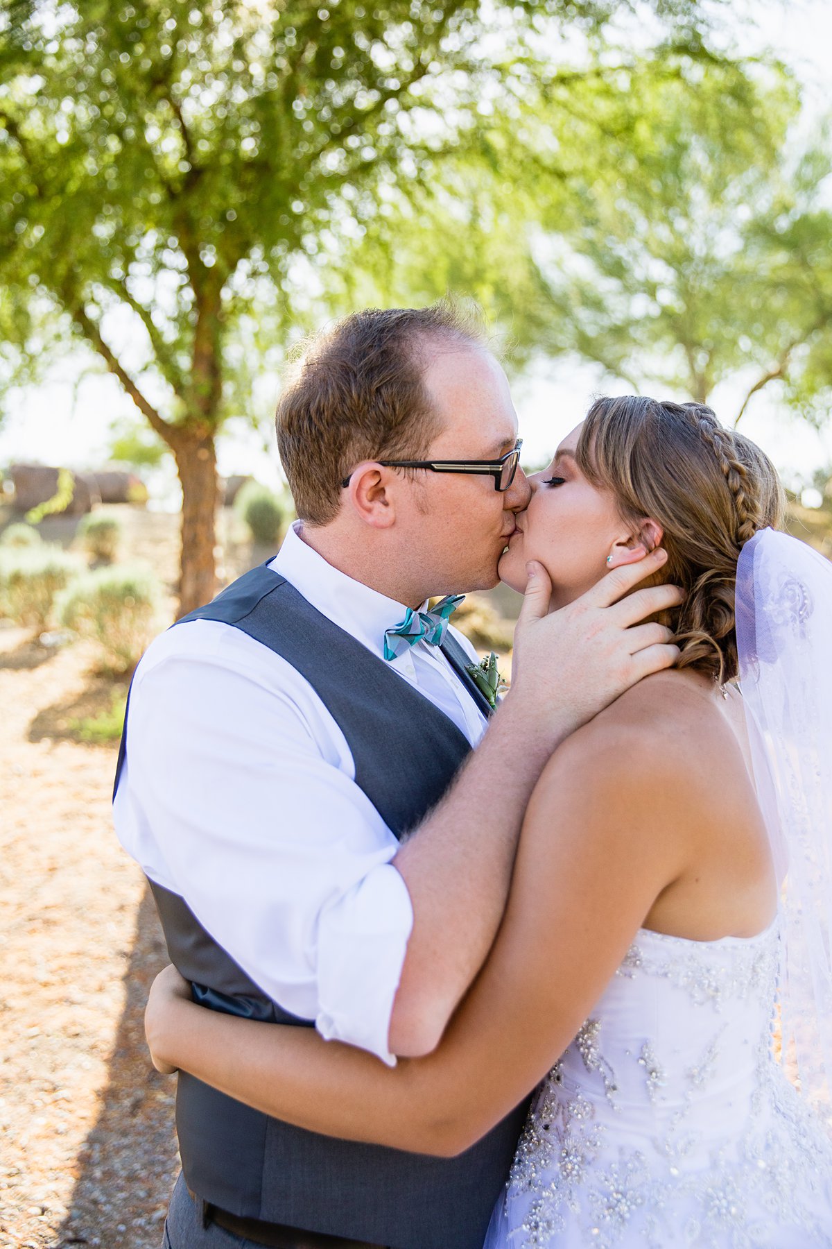 Bride and groom share a kiss.