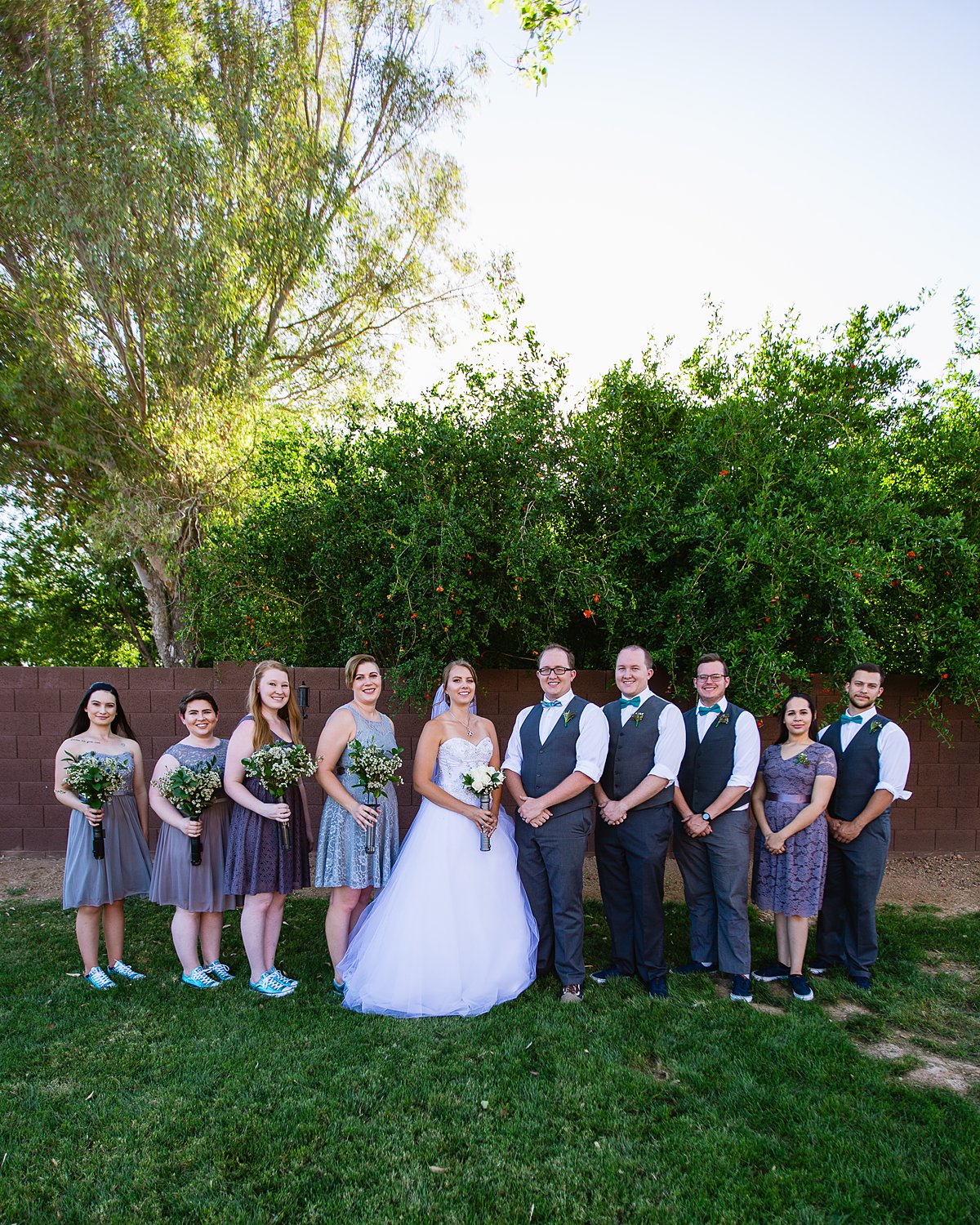 Grey and turquoise mixed gender bridal party in converse and vans by PMA Photography.
