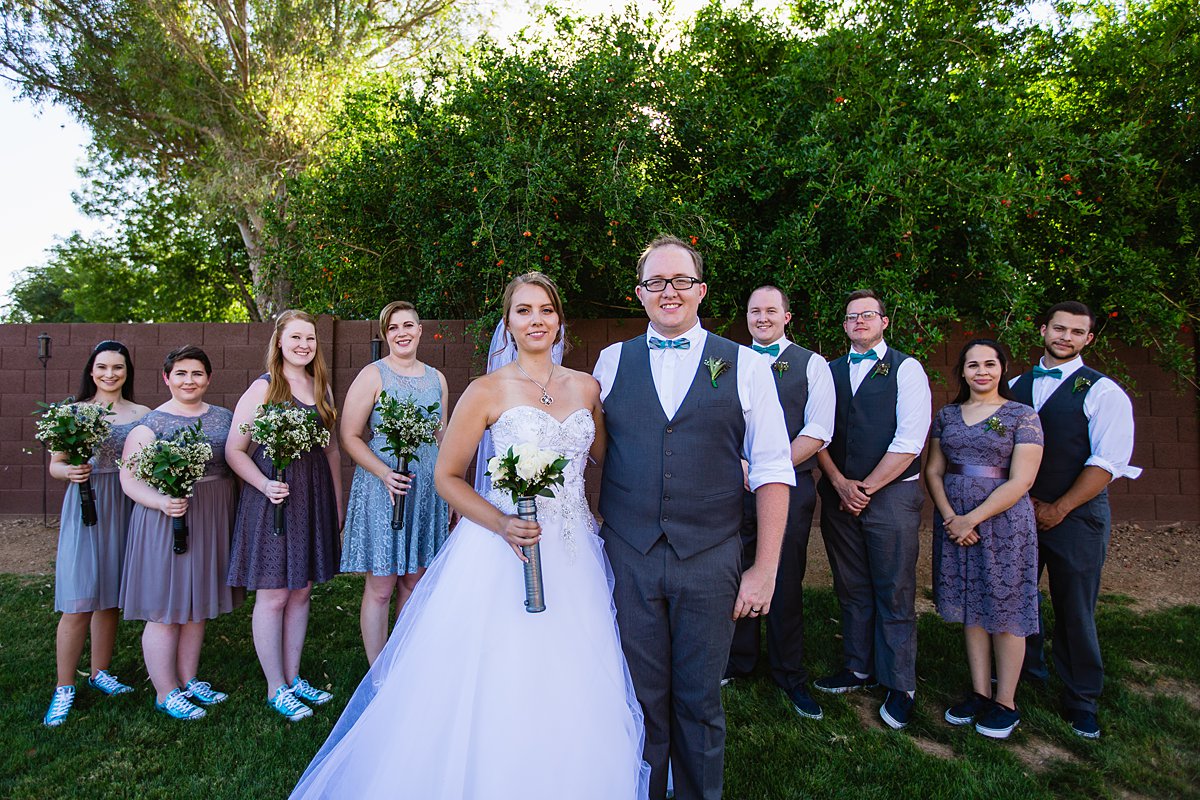 Grey and turquoise mixed gender bridal party in converse and vans by PMA Photography.