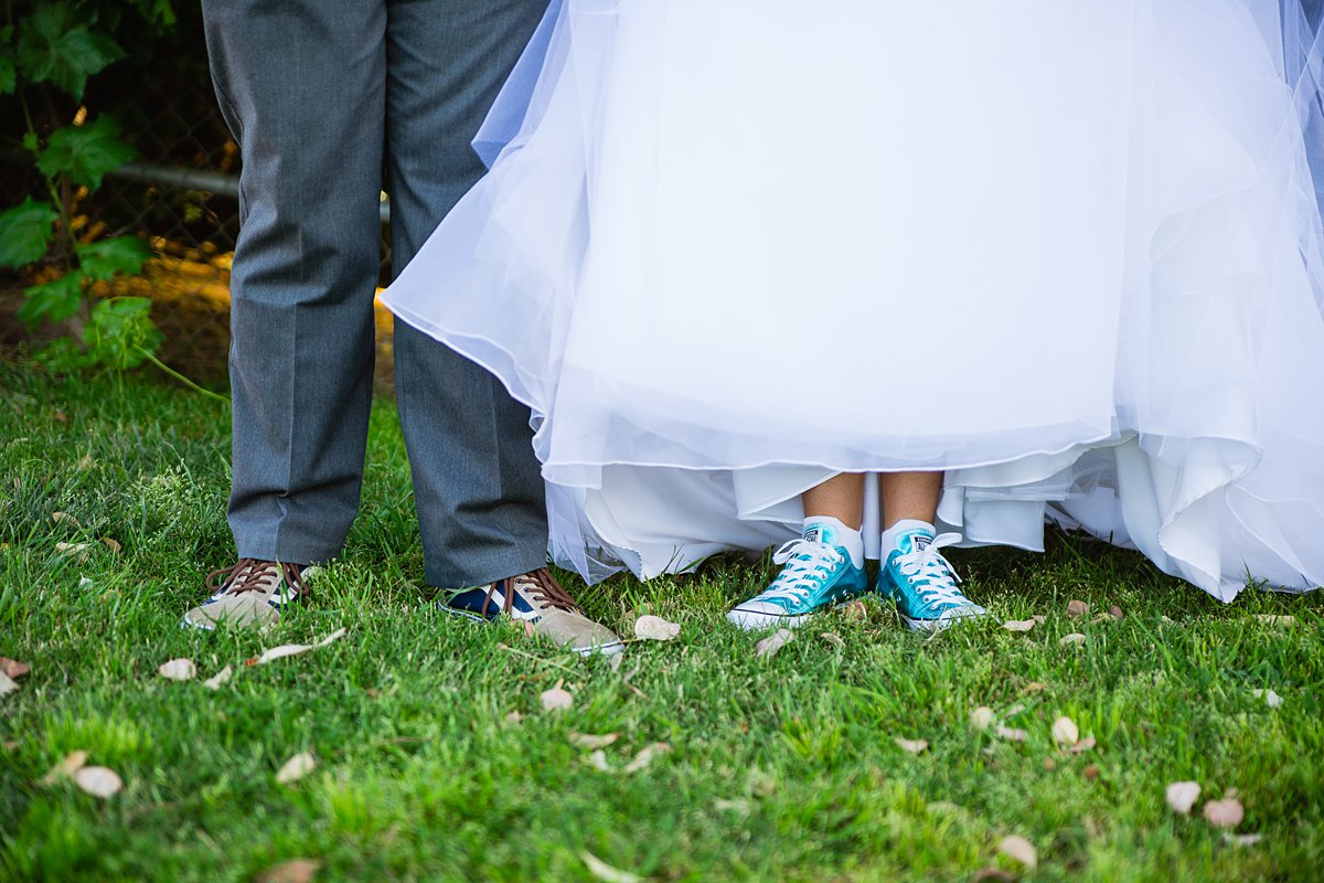 Bride and groom's vans and converse on their wedding day by PMA Photography.