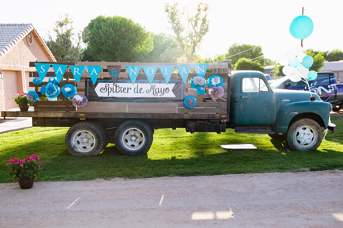 Vintage blue truck decorated for a DIY backyard wedding by Arizona wedding photographer PMA Photography.
