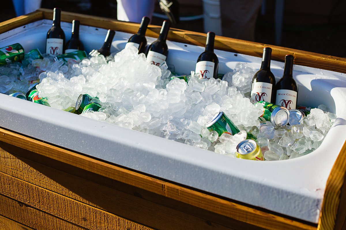 DIY Tub cooler full of drinks for a DIY backyard wedding. Image by PMA Photography.