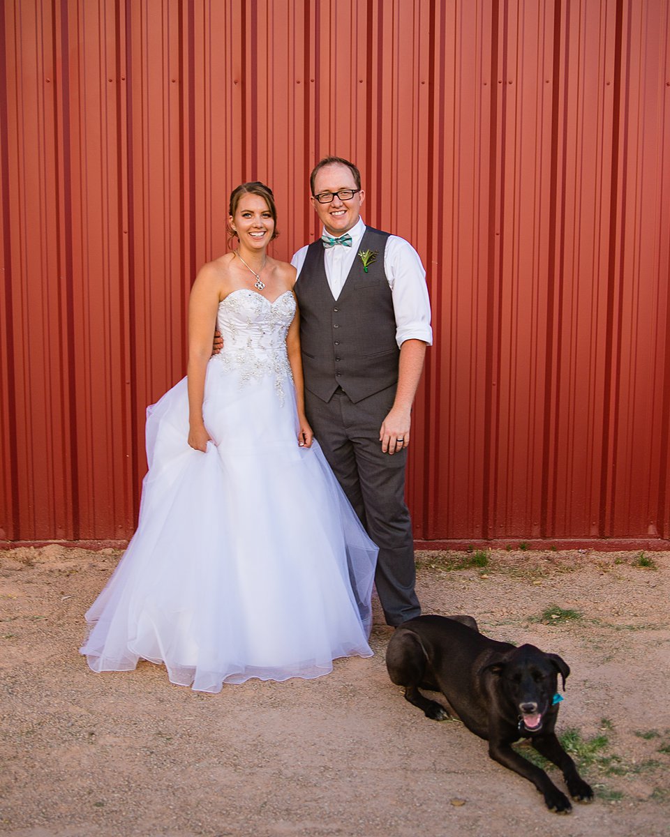 Bride and groom with their dog on their wedding day by PMA Photography.