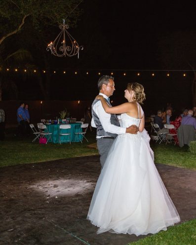 Father daughter dance at a DIY backyard wedding reception by Arizona wedding photographers PMA Photography.