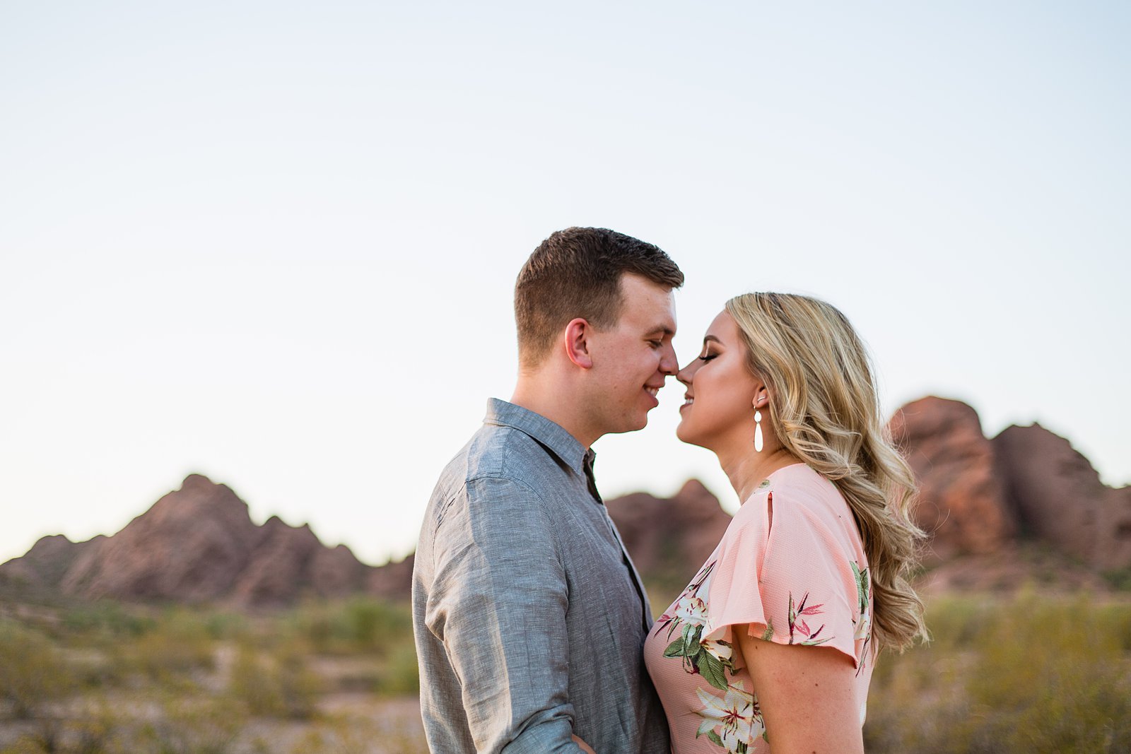 Couple share an intimate moment at their engagement session by authentic engagement photographer PMA Photography.