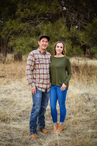 Couple posing together during their winter engagement session by Flagstaff engagement photographer PMA Photography.