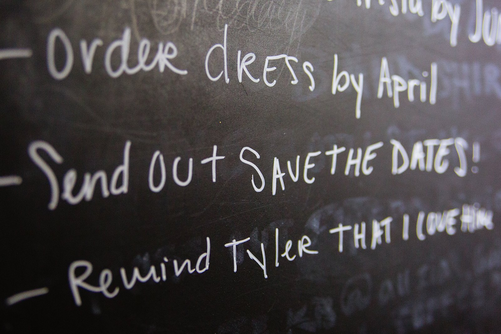 Picture of a chalkboard checklist in the home of a bride while she is getting ready for her wedding day by PMA Photography.