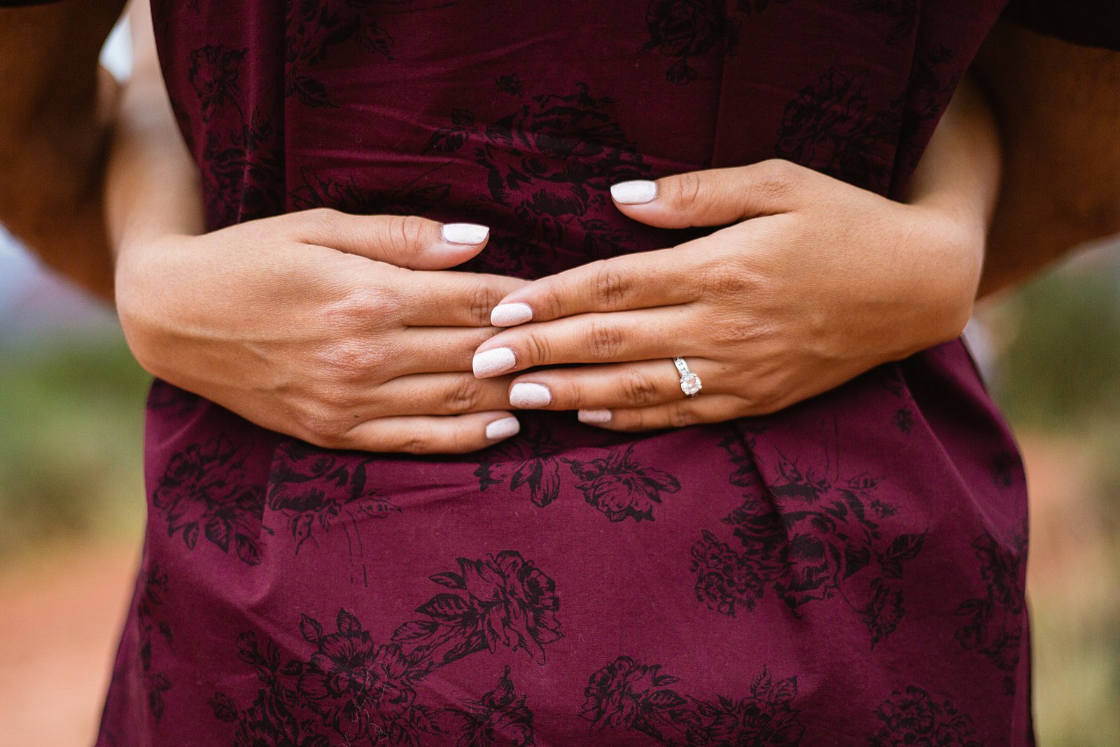 Detail image of engagement ring during an engagement session by PMA Photography.