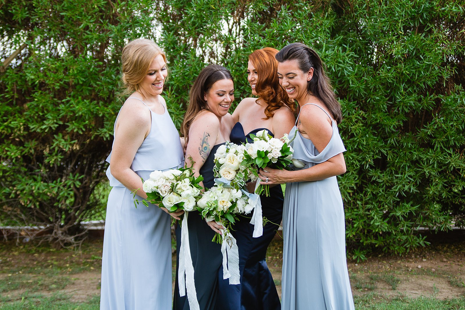 Bridesmaids laughing together at Gather Estate wedding by Phoenix wedding photographer PMA Photography.