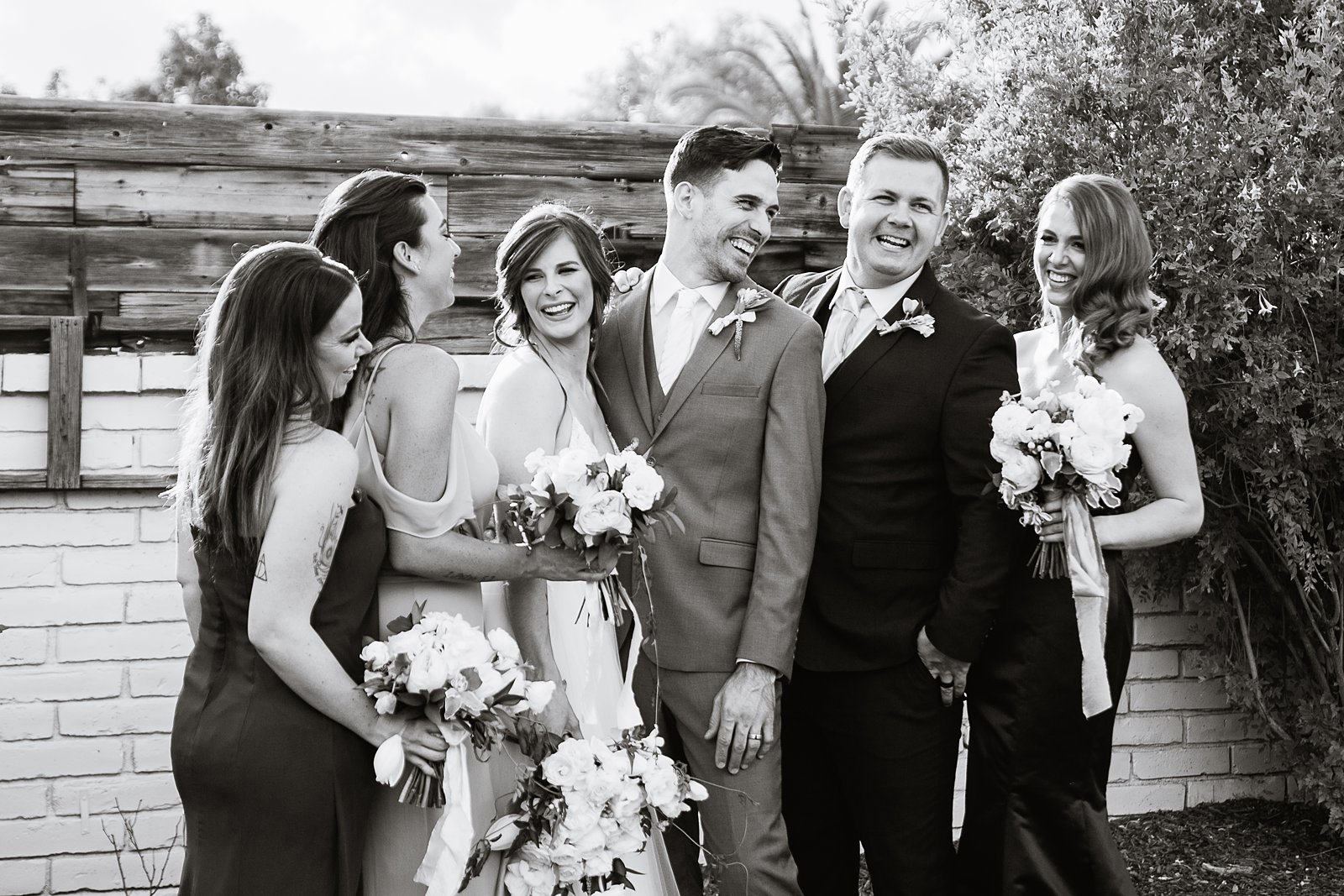 Bridal party laughing together at Gather Estate wedding by Phoenix wedding photographer PMA Photography.
