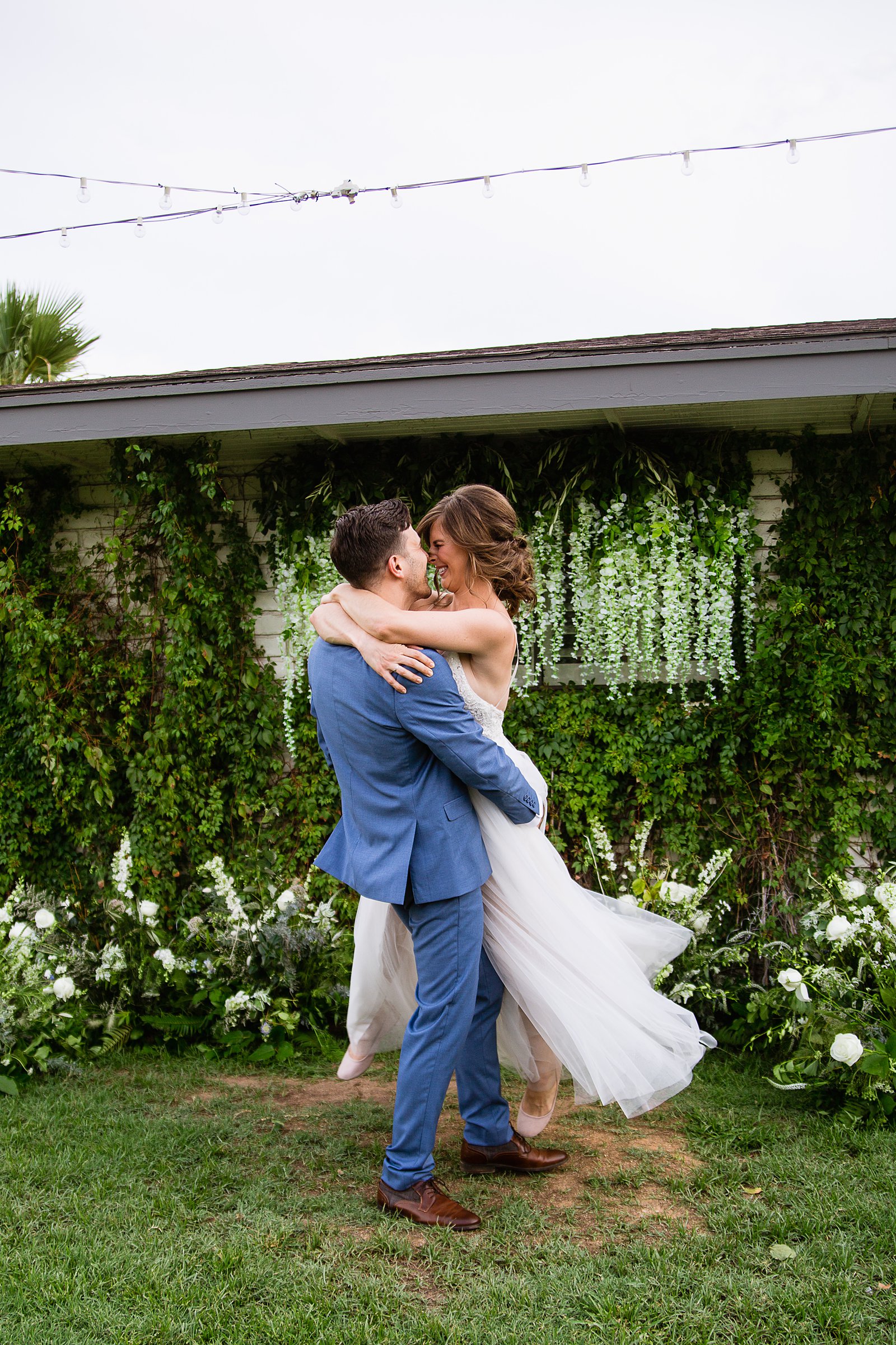 Bride and groom having fun together during their Gather Estate wedding by Phoenix wedding photographer PMA Photography.