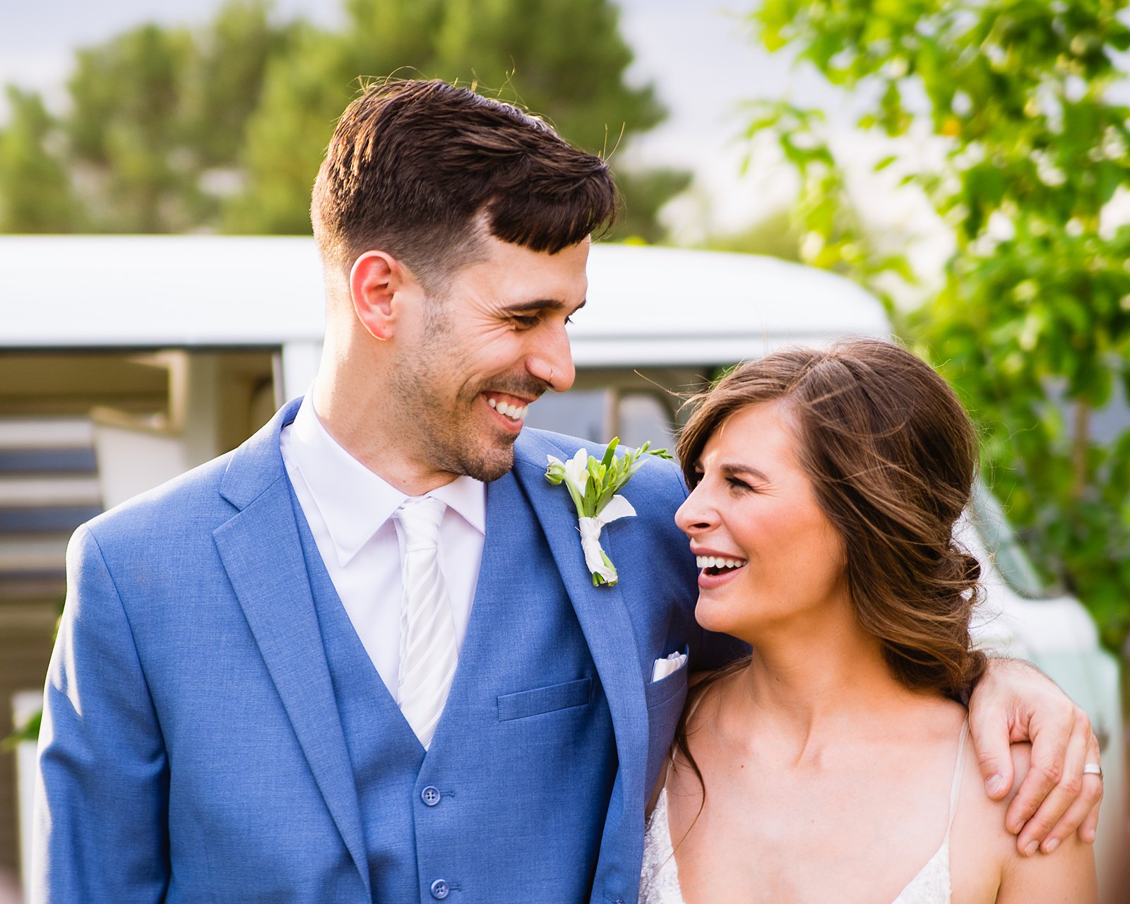 Bride and groom laughing together during their Gather Estate wedding by Phoenix wedding photographer PMA Photography.