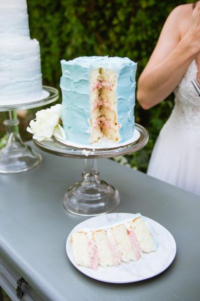 Blue wedding cake with strawberry filling by Arizona wedding photographer PMA Photography.