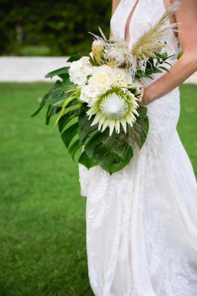 Bride's boho white and cream tropical bouquet by PMA Photography.