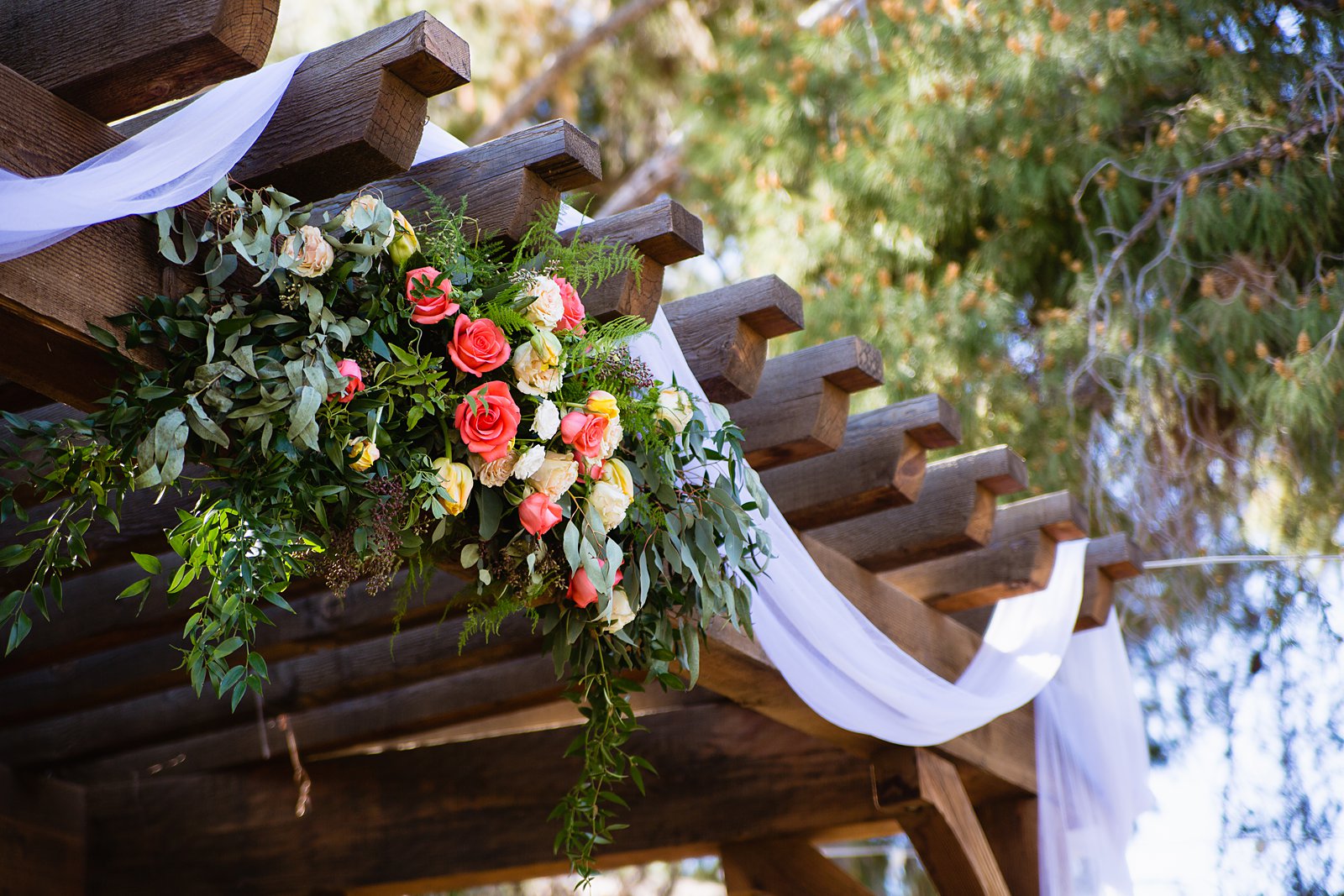 Rustic wedding ceremony decoration at Schnepf Farms by Arizona wedding photographer PMA Photography.