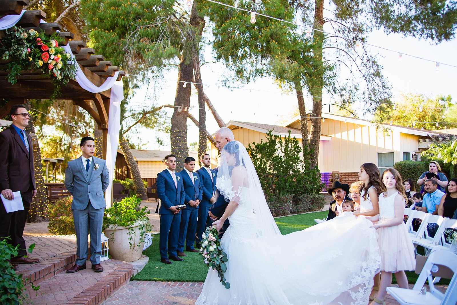 Bride walking down aisle during Schnepf Farms wedding ceremony by Arizona wedding photographer PMA Photography.