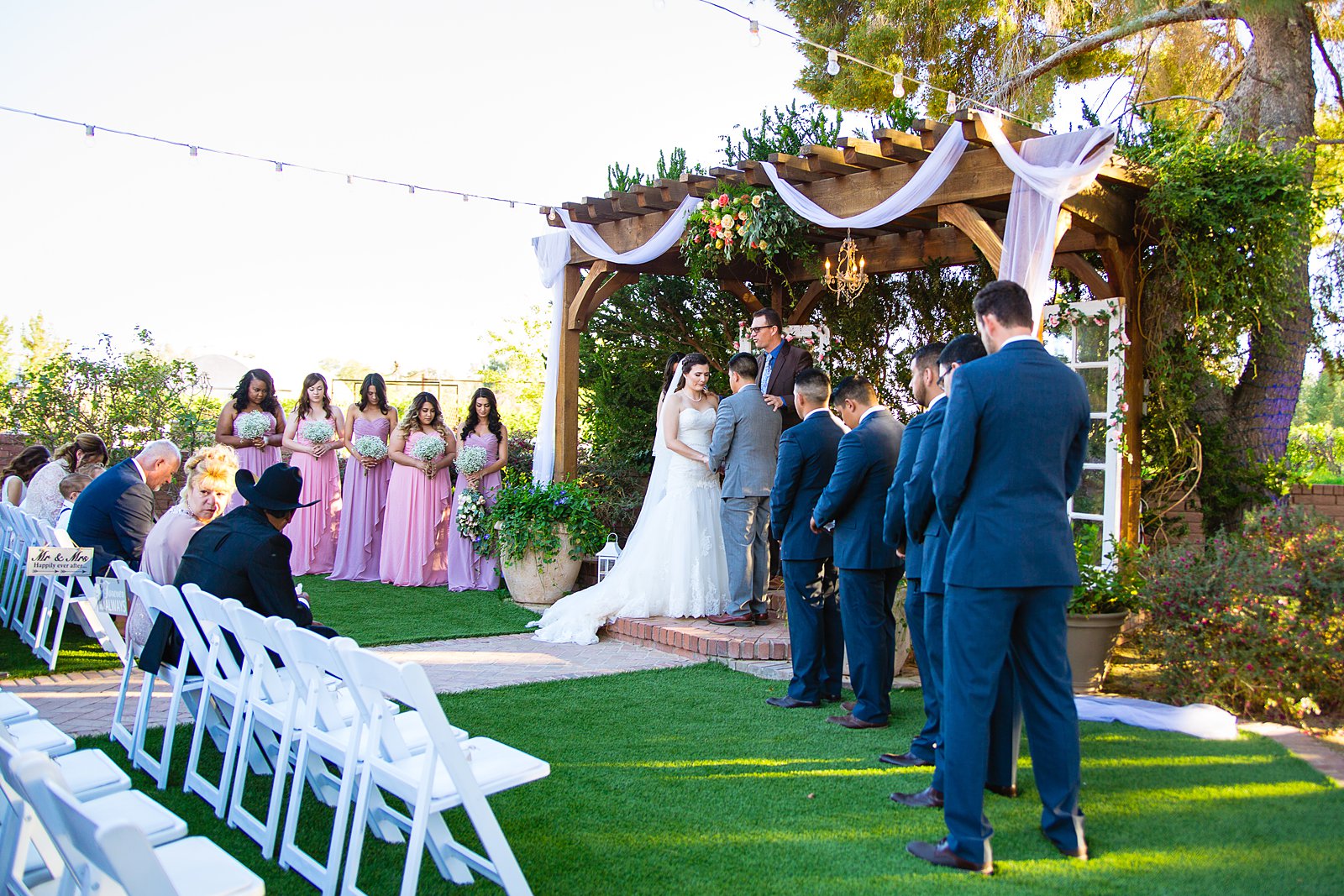 Wedding ceremony at Schnepf Farms by Arizona wedding photographer PMA Photography.