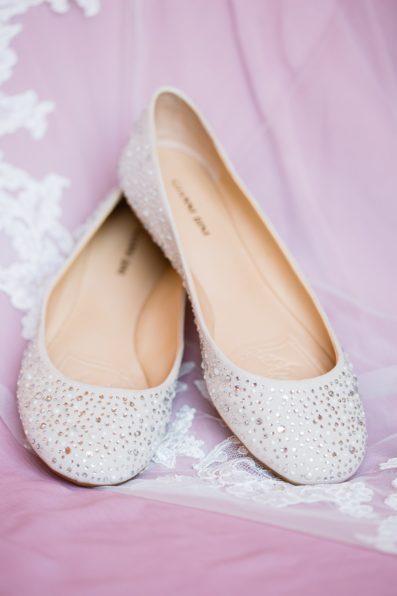 Brides's wedding day details of veil and ballet flats by PMA Photography.