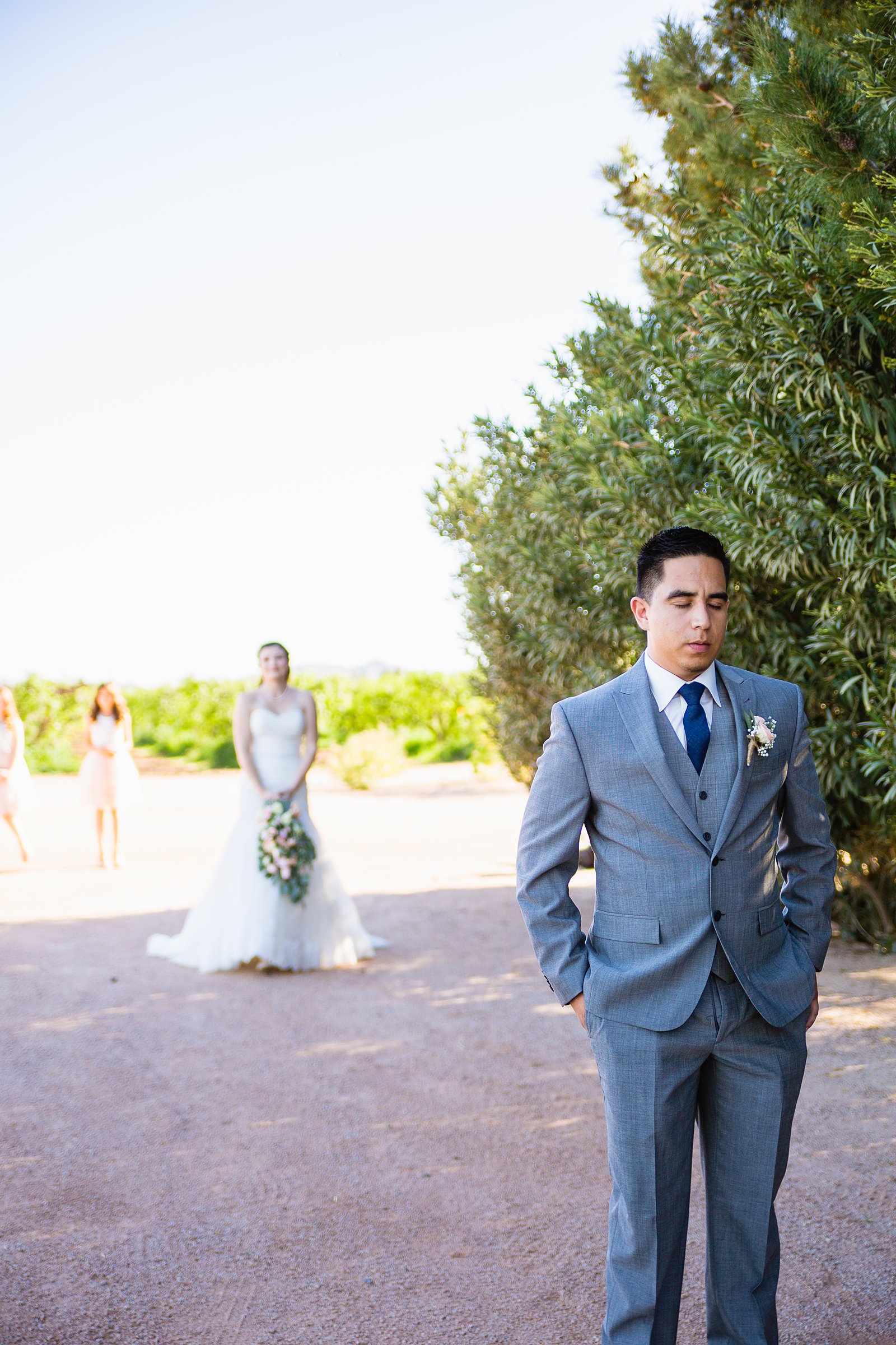 Bride and groom's first look at Schnepf Farms by Arizona wedding photographer PMA Photography.