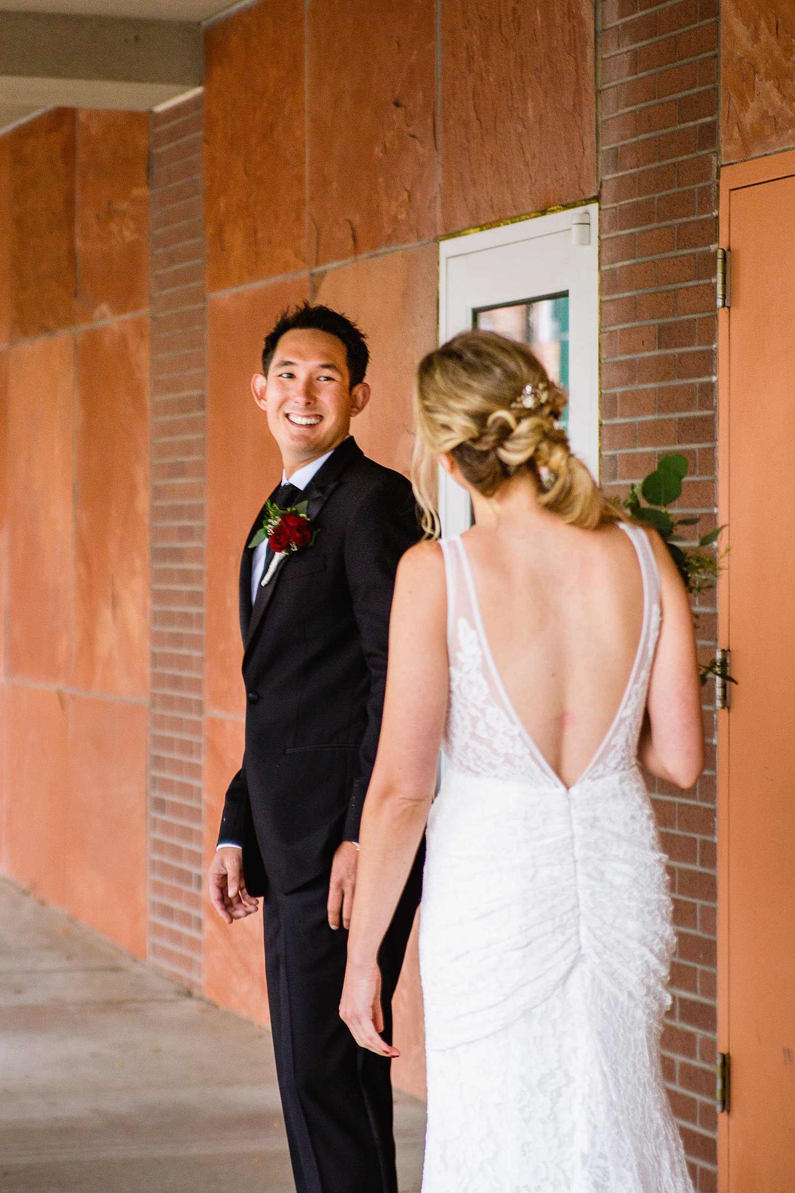 Bride and groom's first look at Flagstaff Courthouse by Arizona wedding photographer PMA Photography.