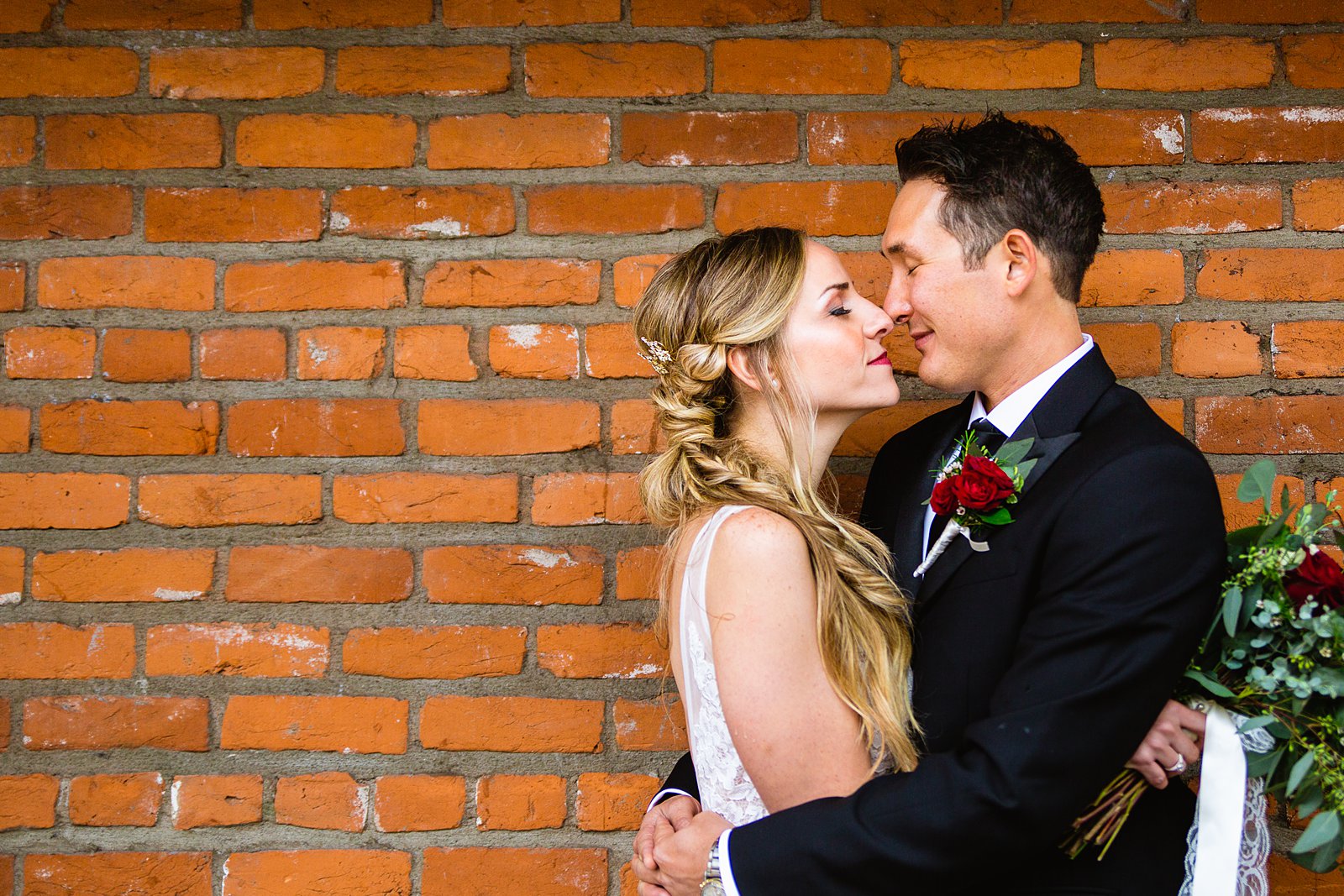 Bride and groom share an intimate moment during their downtown Flagstaff wedding by Flagstaff wedding photographer PMA Photography.