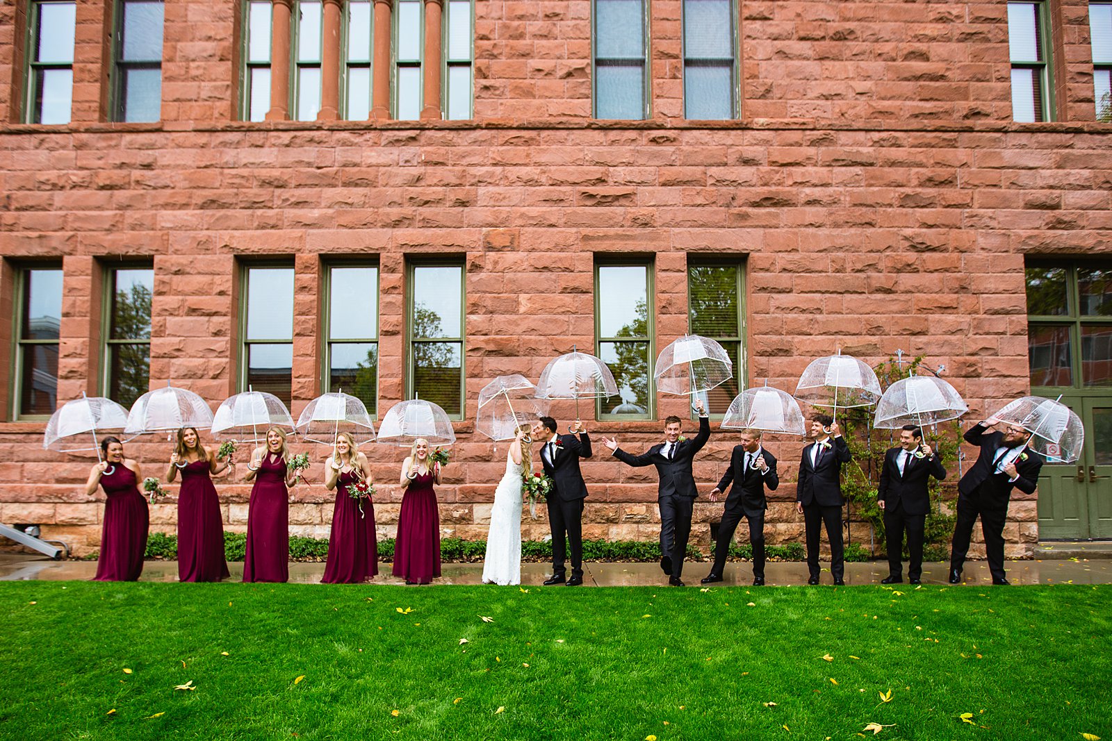 Bridal party having fun together at downtown Flagstaff weding by Arizona wedding photographer PMA Photography.