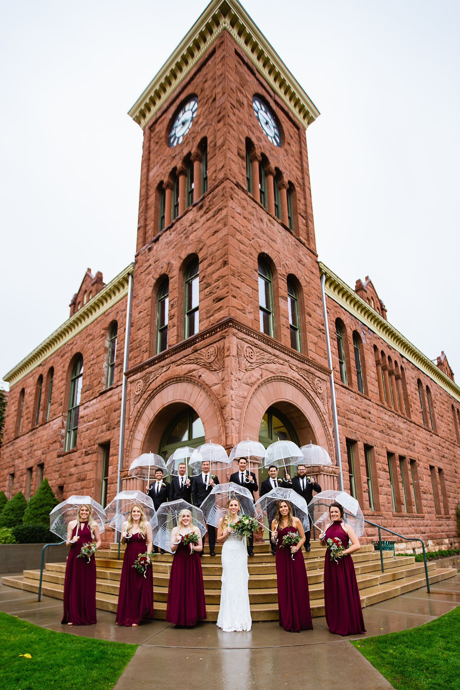 Rainy day Bridal party together at a downtown Flagstaff wedding by Arizona wedding photographer PMA Photography.