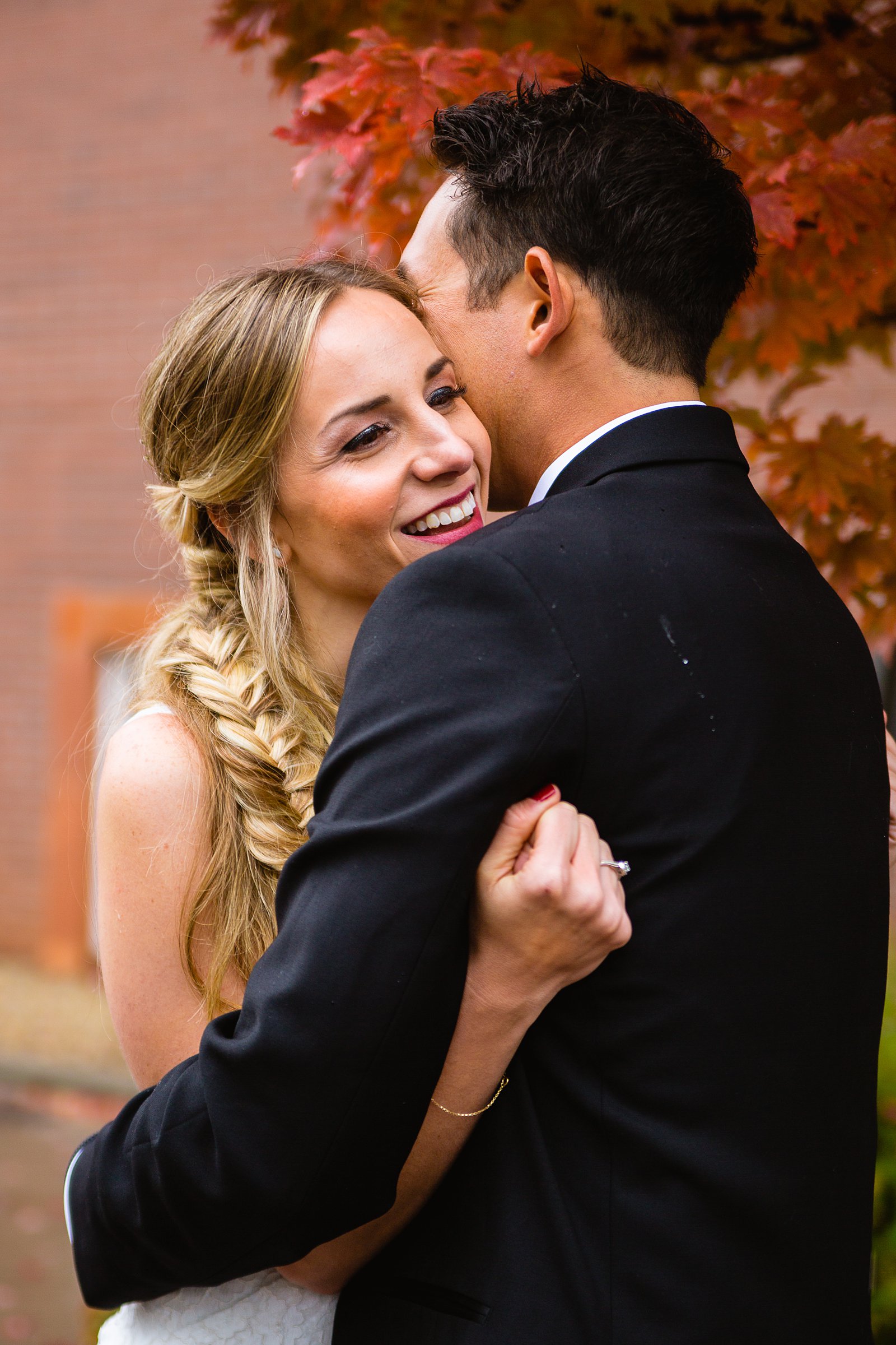 Bride and groom share an intimate moment during their downtown Flagstaff wedding by Flagstaff wedding photographer PMA Photography.