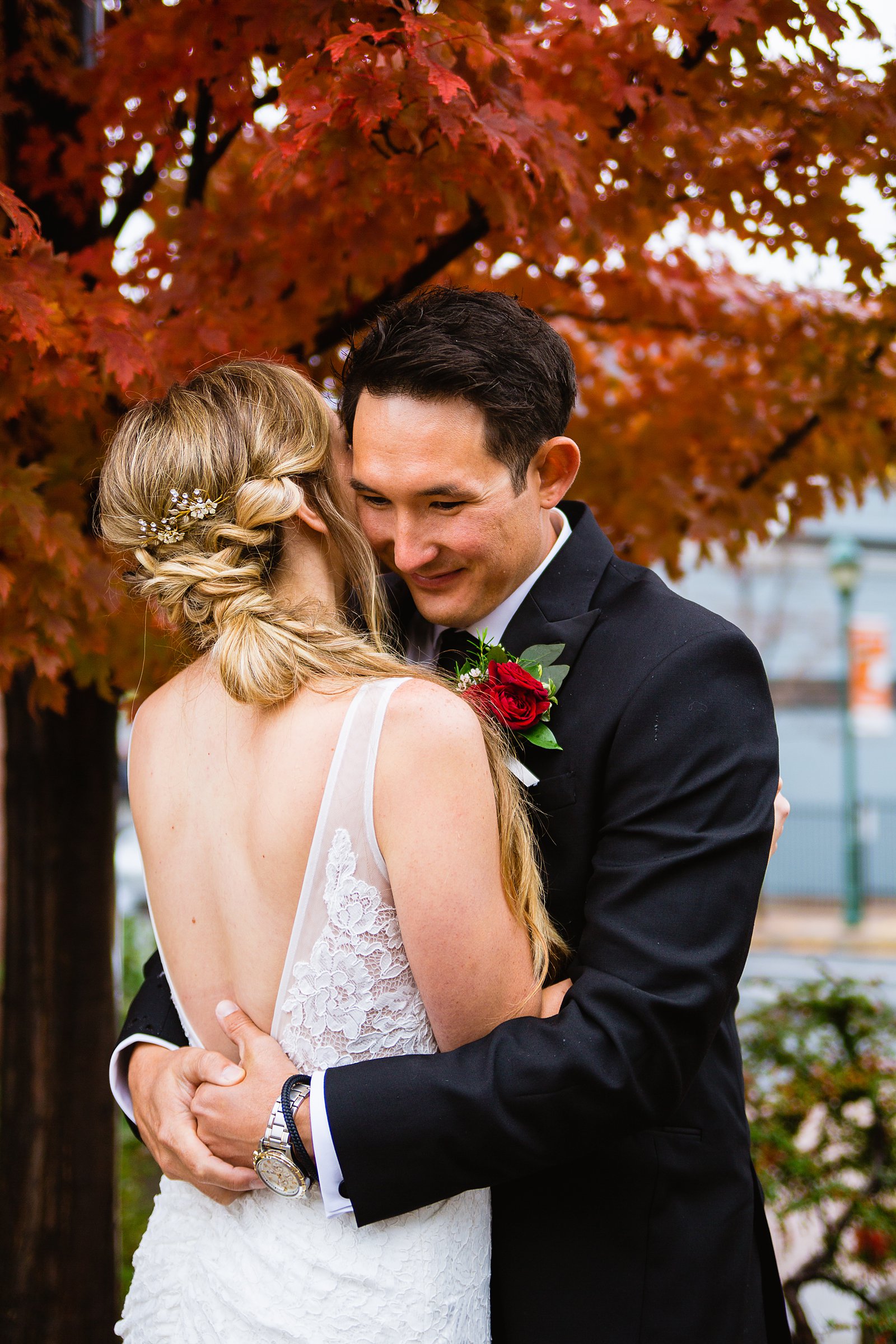 Bride and groom share an intimate moment at their downtown Flagstaff wedding by Arizona wedding photographer PMA Photography.
