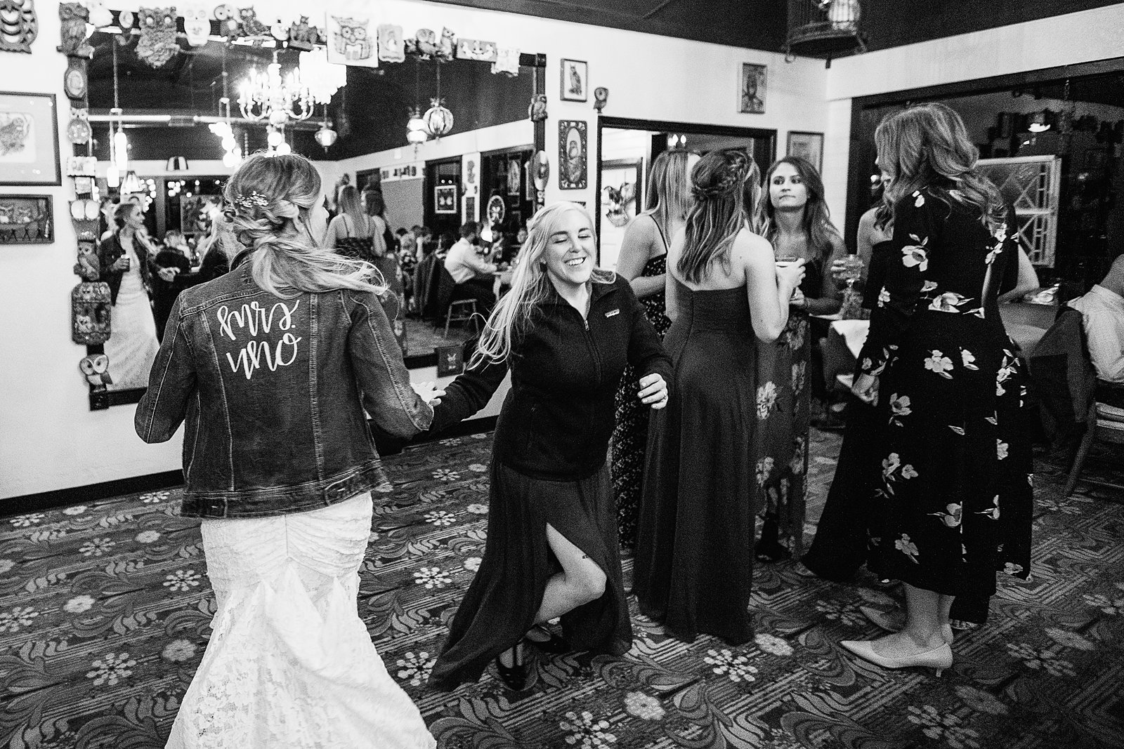 Bride dancing with guests at Toasted Owl wedding reception by Flagstaff wedding photographer PMA Photography