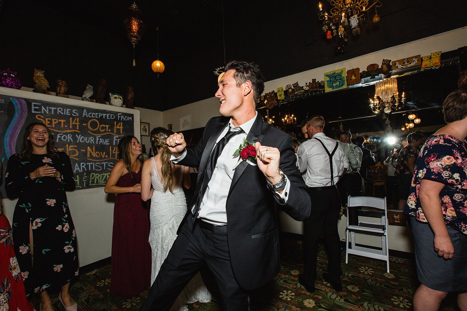 Groom dancing with guests at Toasted Owl wedding reception by Flagstaff wedding photographer PMA Photography