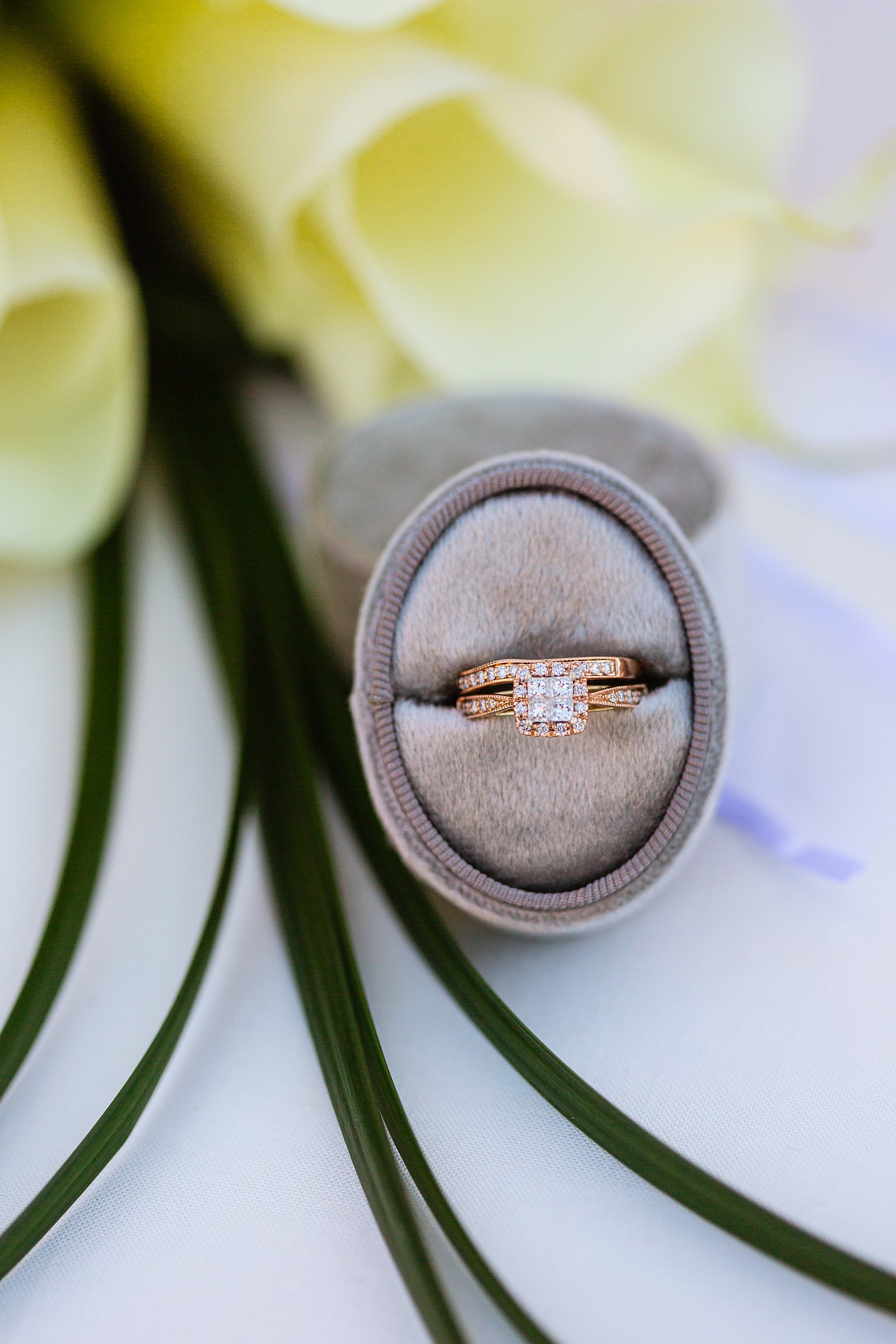 Brides's wedding day details of a rose gold and diamond engagement ring and wedding band by PMA Photography.