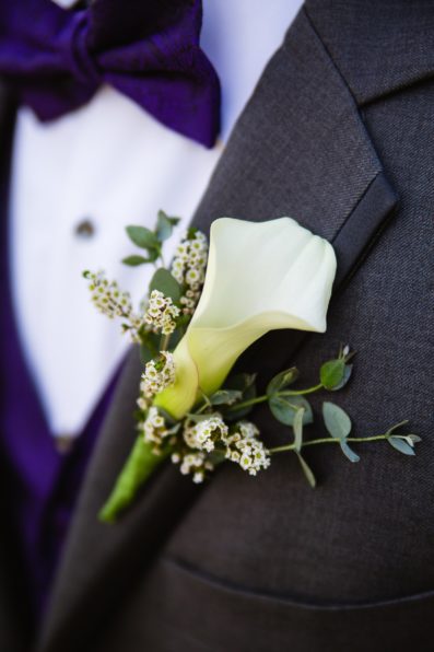 Groom's modern calla lily boutonniere by PMA Photography.