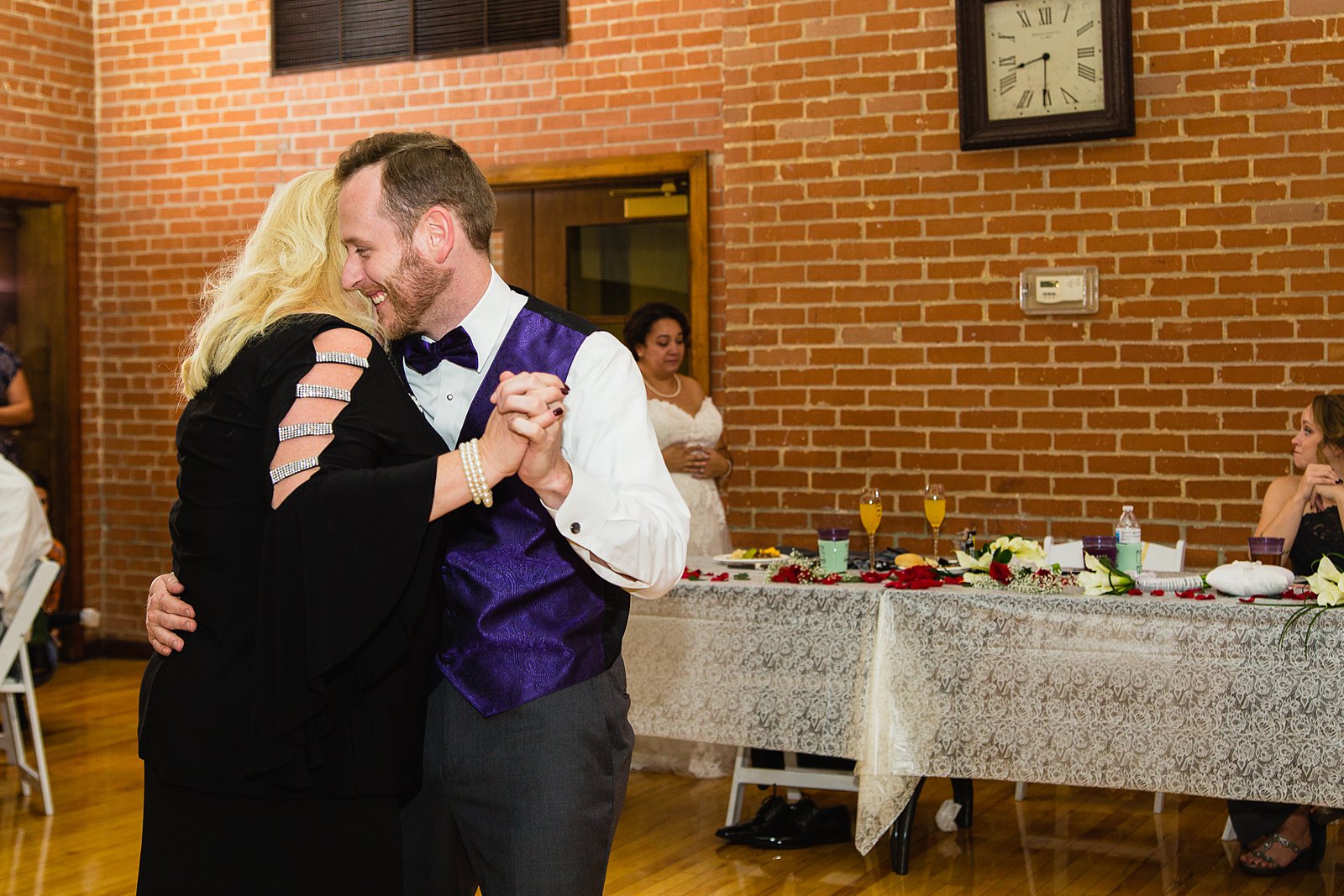 Groom dancing with his mother at Encanto Park wedding by Phoenix wedding photographer PMA Photography.