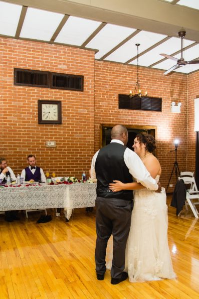 Bride dancing with her father at Encanto Park wedding by Phoenix wedding photographer PMA Photography.