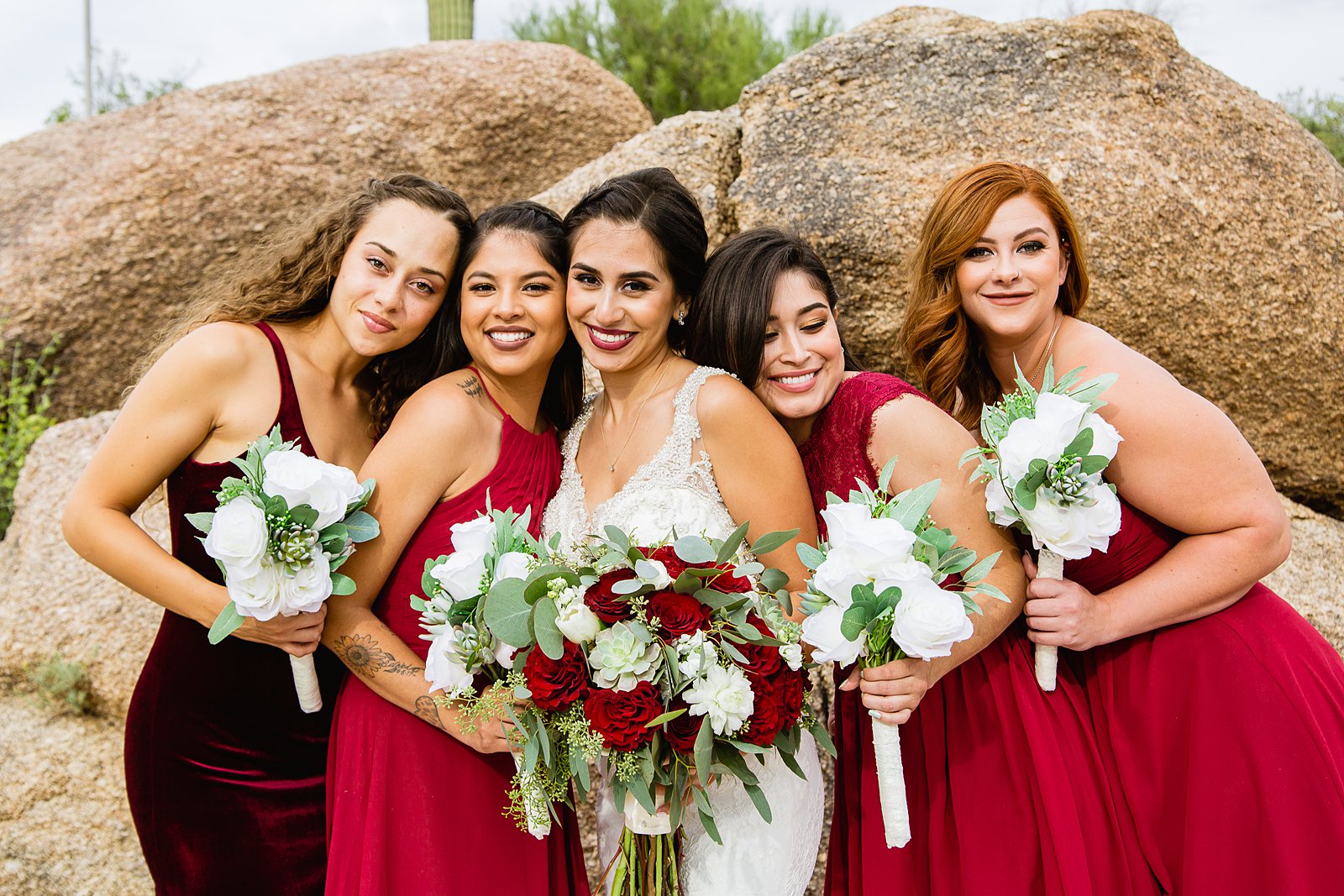 Bride and bridesmaids together at a Troon North wedding by Arizona wedding photographer PMA Photography.