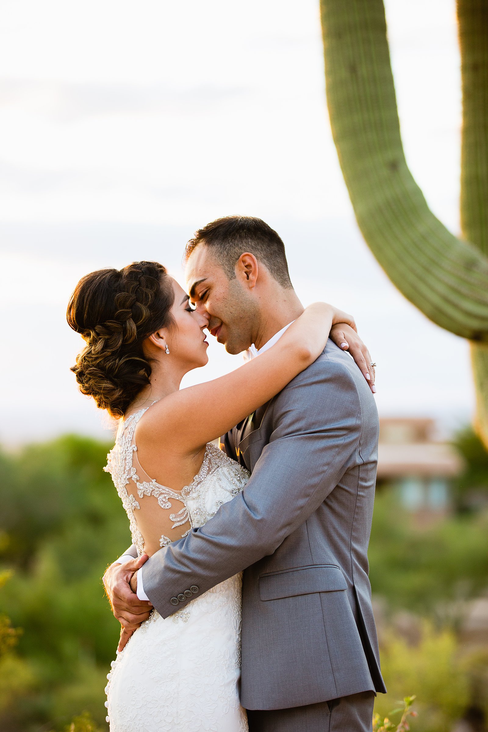 Bride and groom share an intimate moment at their Troon North wedding by Arizona wedding photographer PMA Photography.