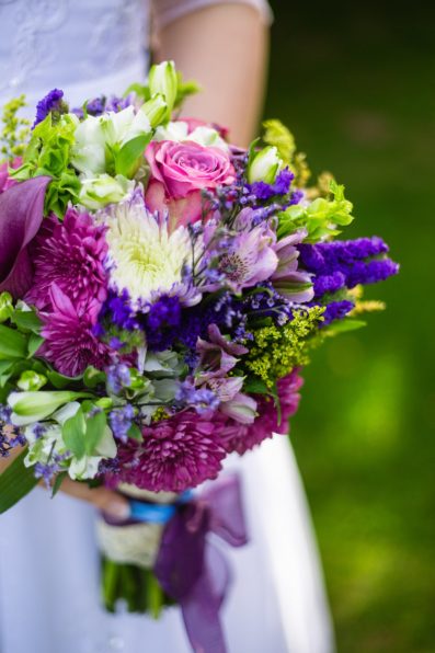 Bride's colorful purple bouquet by PMA Photography.