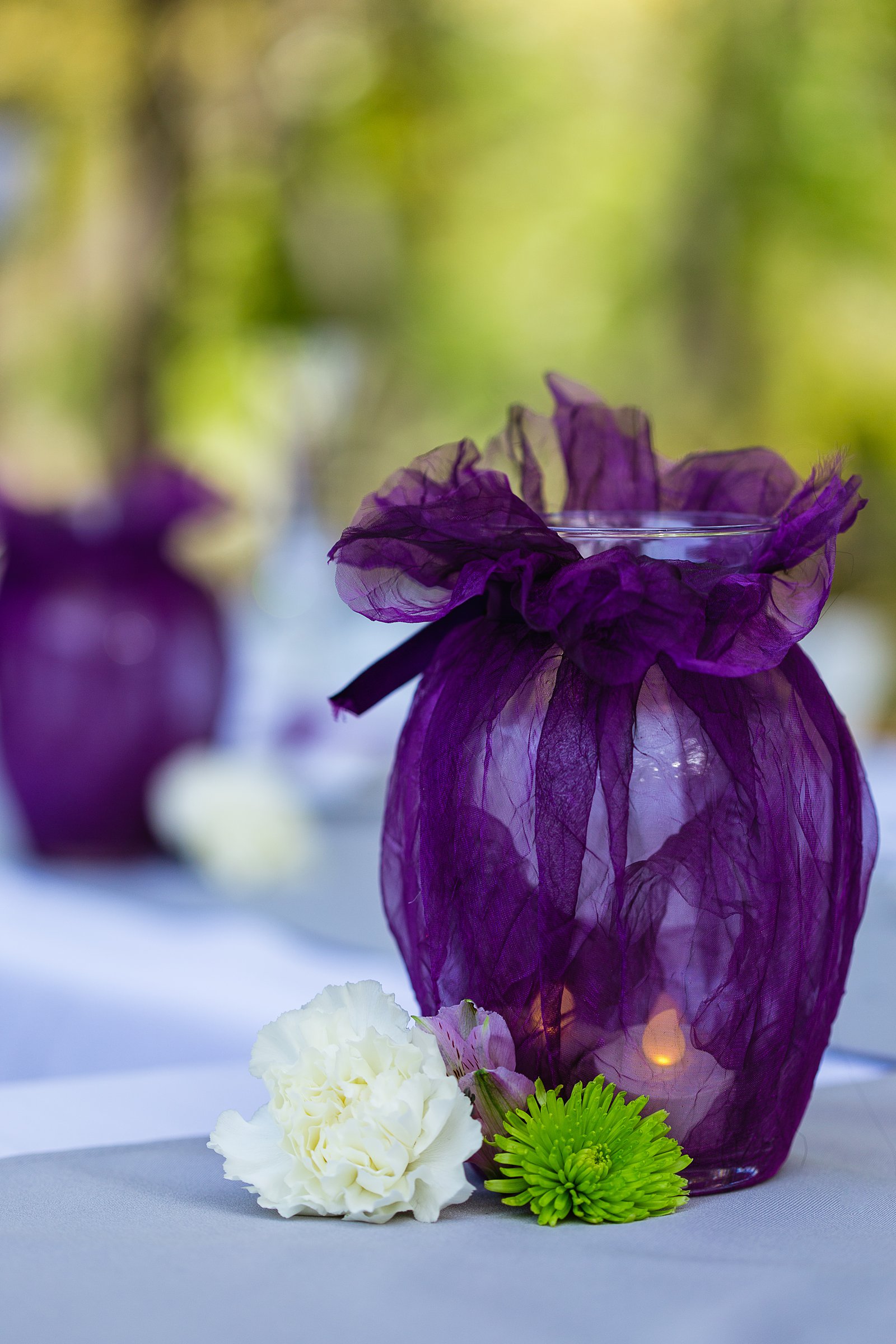 Simple, purple reception decorations at L'Auberge de Sedona wedding reception by Sedona wedding photographer PMA Photography.