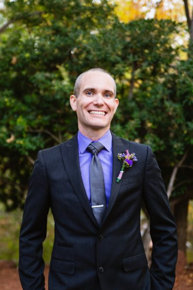 Groom's grey and purple suit for his L'Auberge de Sedona wedding by PMA Photography.