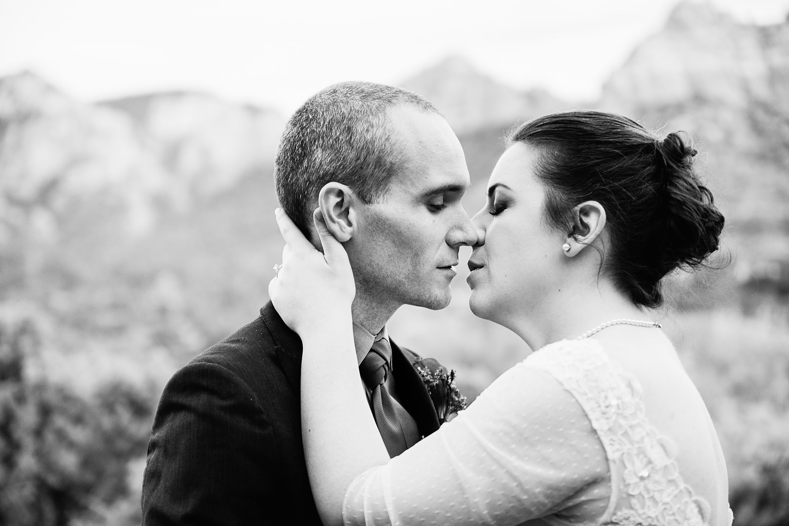 Bride and groom share an intimate moment at their L'Auberge de Sedona wedding by Arizona wedding photographer PMA Photography.