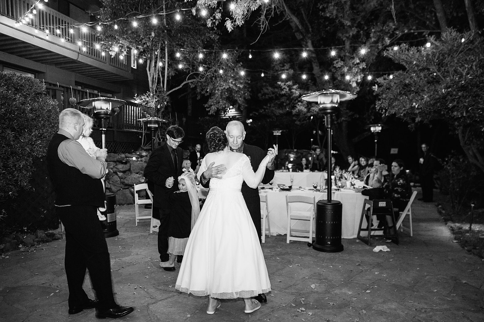 Bride dancing with guests at L'Auberge de Sedona wedding reception by Sedona wedding photographer PMA Photography