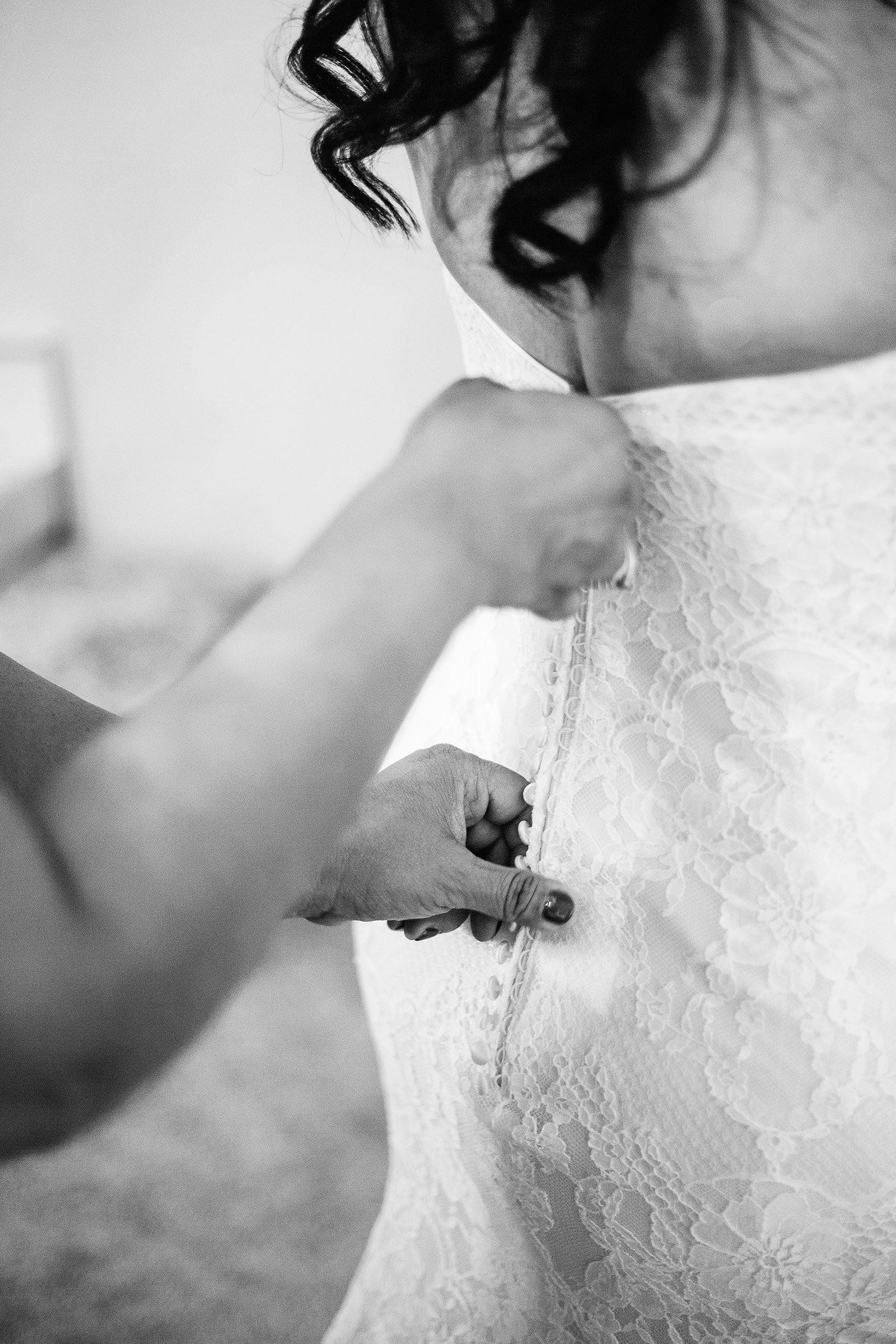 Bride getting ready for her wedding by Arizona wedding photographers PMA Photographer